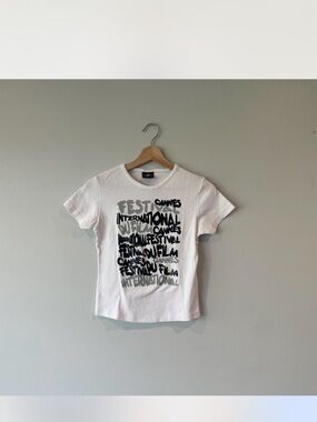 Spirit White Graphic Cannes Festival Baby Tee